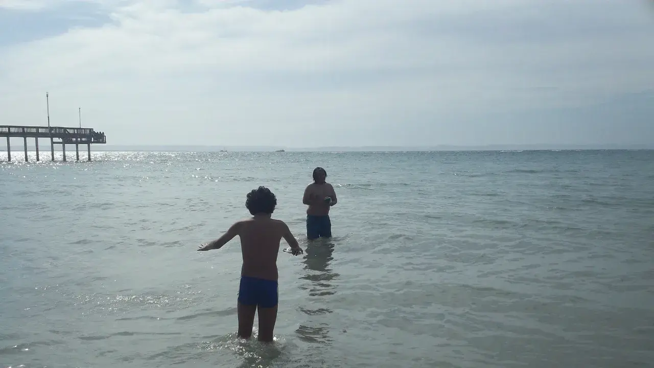 An old photo, at sunset, a natural pool.